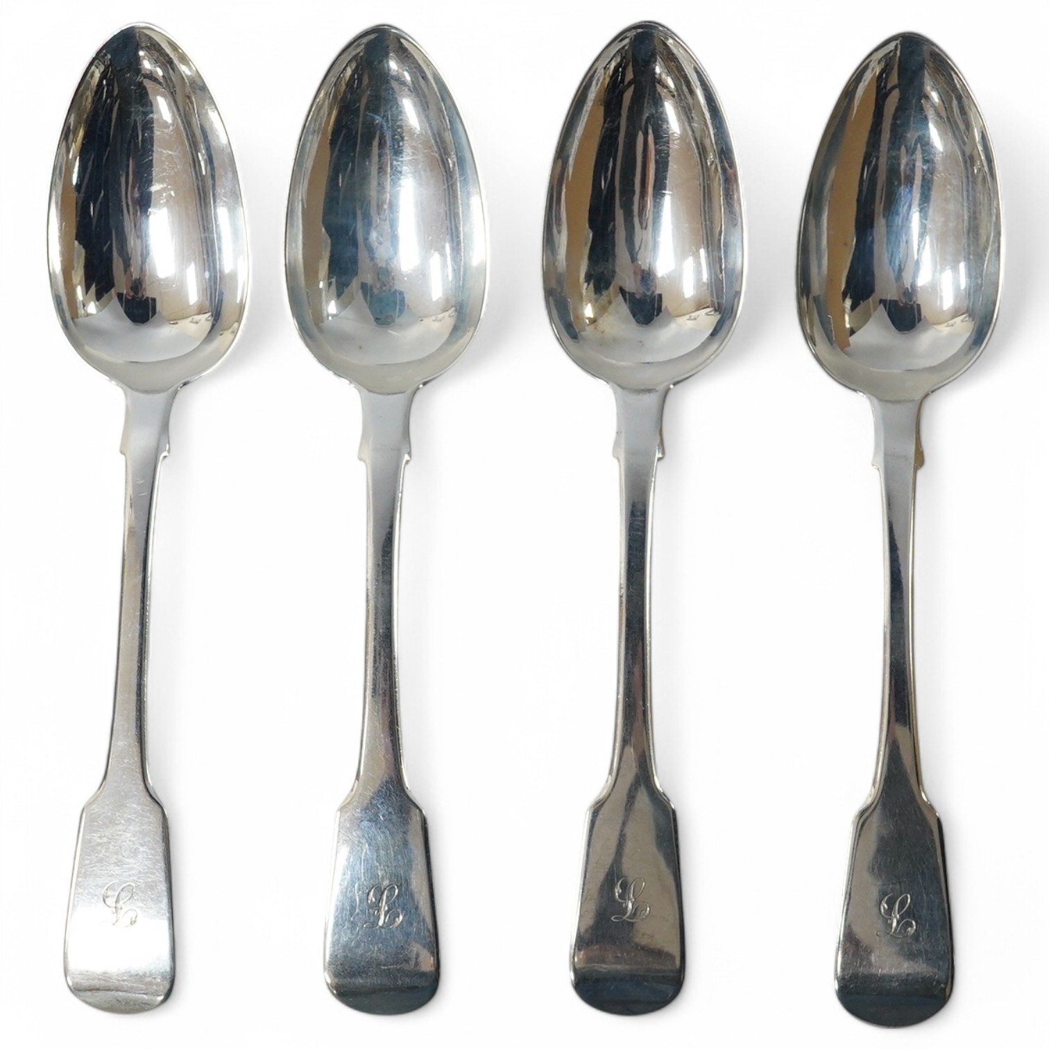 A set of four George IV silver fiddle pattern table spoons by Jonathan Hayne, London, 1827, 22.7cm, all with engraved initial, 9.5oz. Condition - fair to good